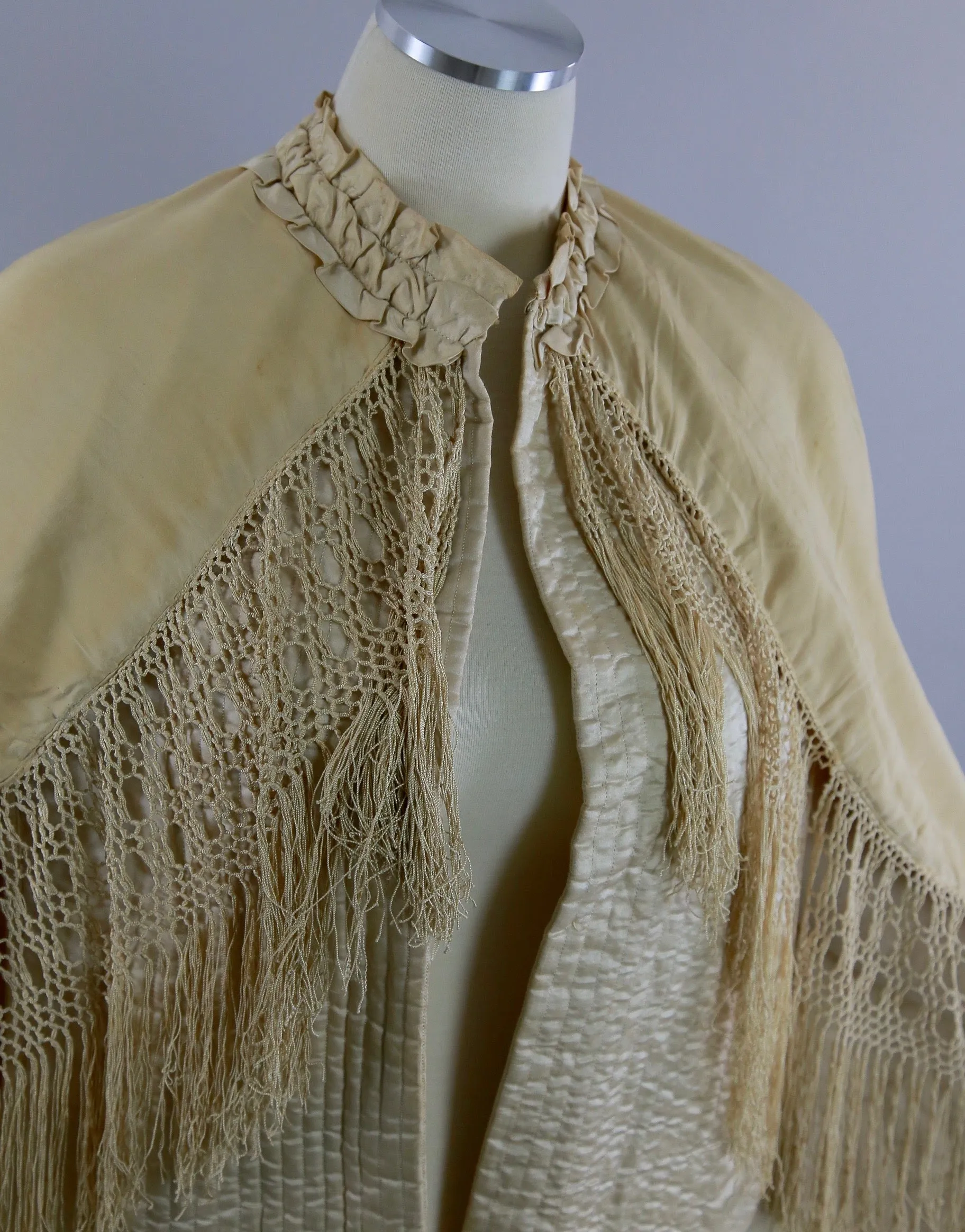 Antique Victorian ruched cape with quilted lining long hand knotted fringe trim