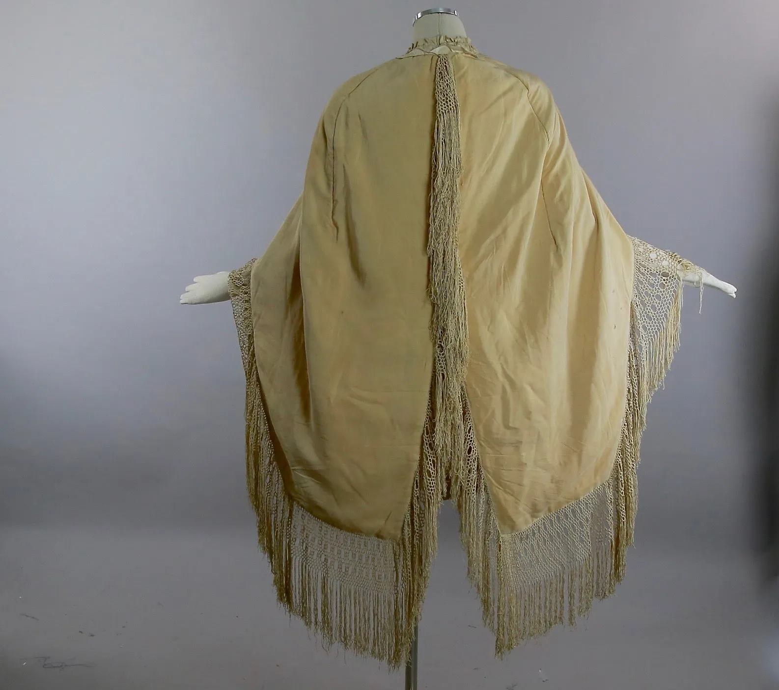 Antique Victorian ruched cape with quilted lining long hand knotted fringe trim