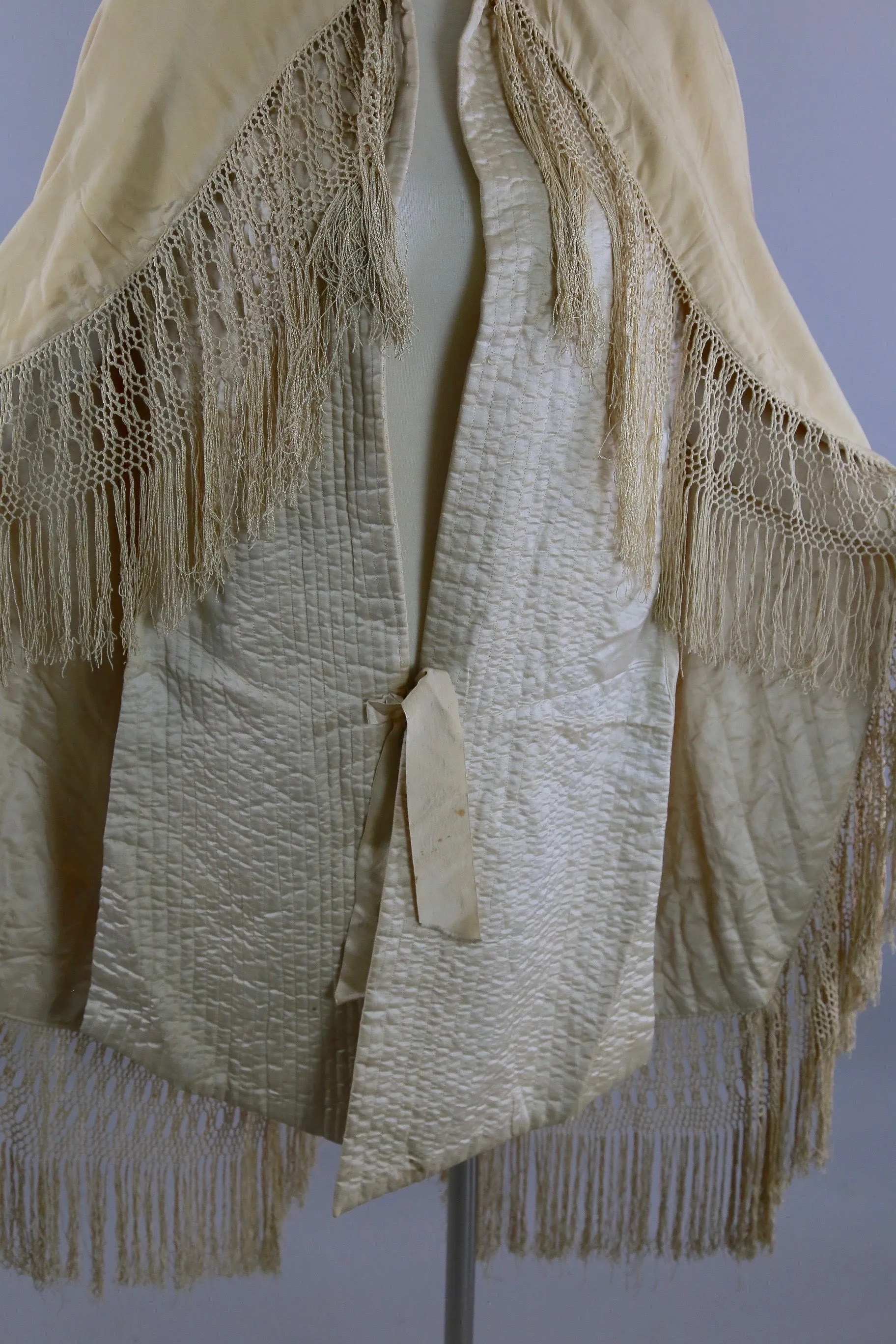 Antique Victorian ruched cape with quilted lining long hand knotted fringe trim