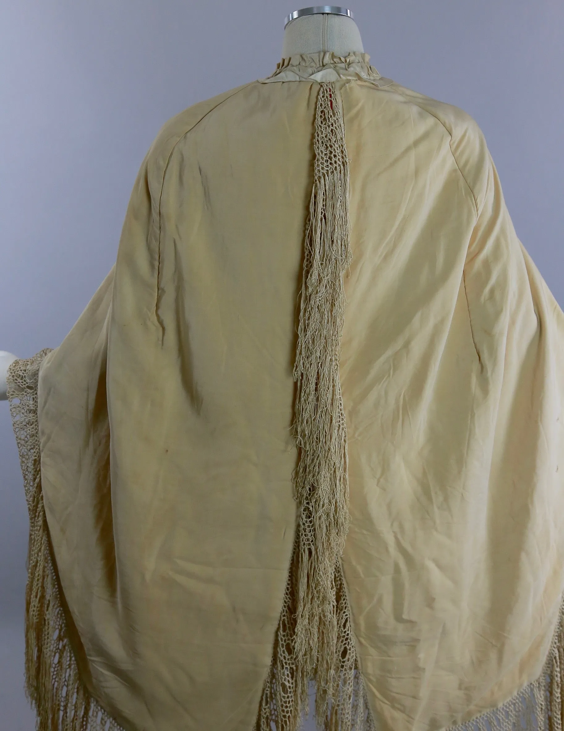 Antique Victorian ruched cape with quilted lining long hand knotted fringe trim