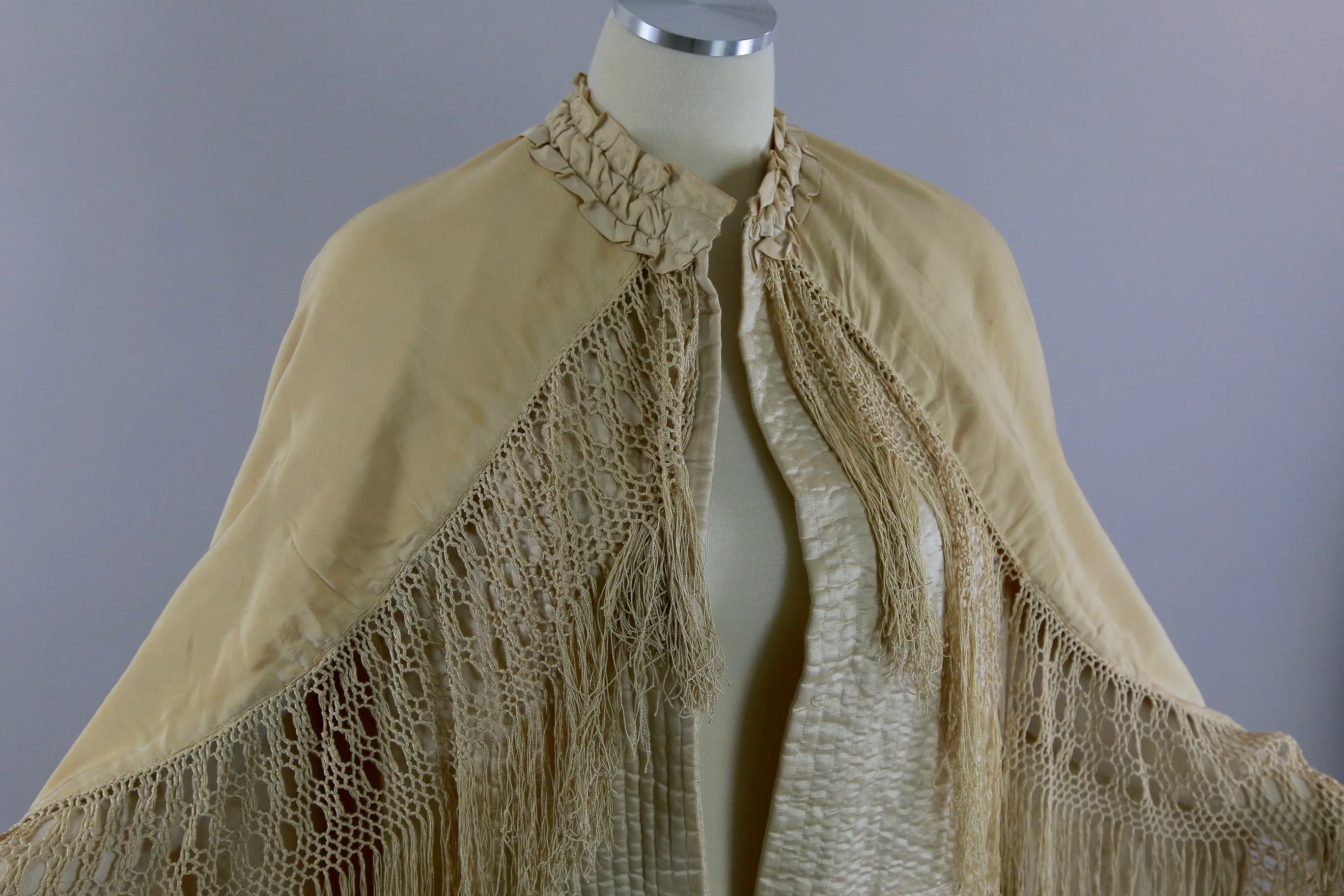 Antique Victorian ruched cape with quilted lining long hand knotted fringe trim