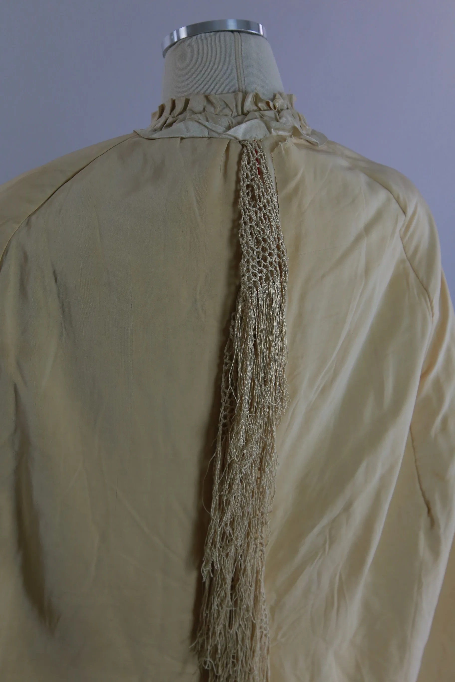 Antique Victorian ruched cape with quilted lining long hand knotted fringe trim